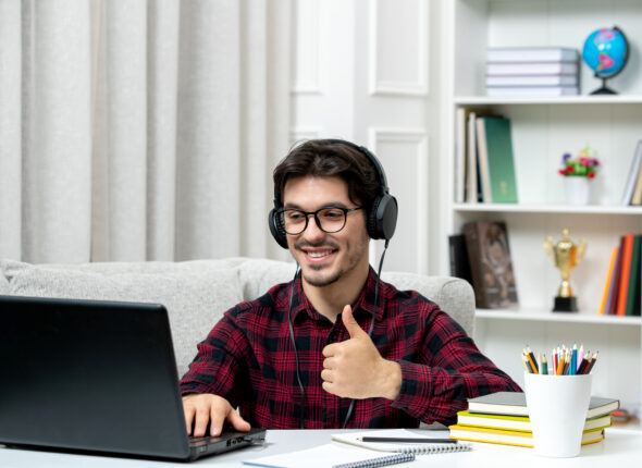 student-online-cute-guy-checked-shirt-with-glasses-studying-computer-showing-good-gesture