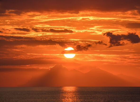 Beautiful golden orange sunset over the ocean.